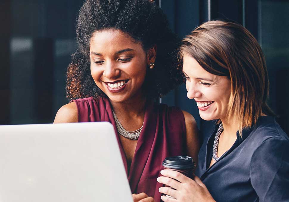 Two business owers using a laptop